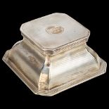 A George V silver desk inkwell, Hukin & Heath, Birmingham 1916, canted and shaped square form with