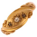 An early 20th century 18ct gold graduated three stone diamond gypsy ring, set with old and rose-