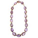 A Victorian amethyst Riviere necklace, the graduated oval amethysts set in unmarked gold cut-down