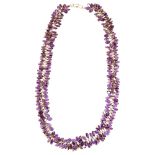 A modern 9ct gold amethyst grape cluster necklace, set with oval mixed-cut amethysts, necklace