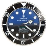 **WITHDRAWN** A reproduction Rolex style Sea-Dweller Deepsea Date quartz wall clock, diameter 34cm.