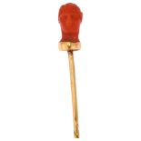 An Italian 19th century coral head stickpin, circa 1870, unmarked gold settings, head height 11.7mm,