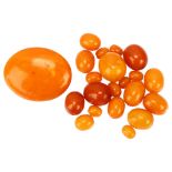 A group of loose graduated butterscotch amber beads, bead lengths 21.1 - 9.5mm, and an oval amber