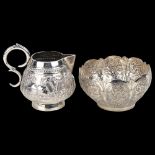 An Indian silver cream jug and lobed bowl, allover relief embossed and engraved decoration, jug