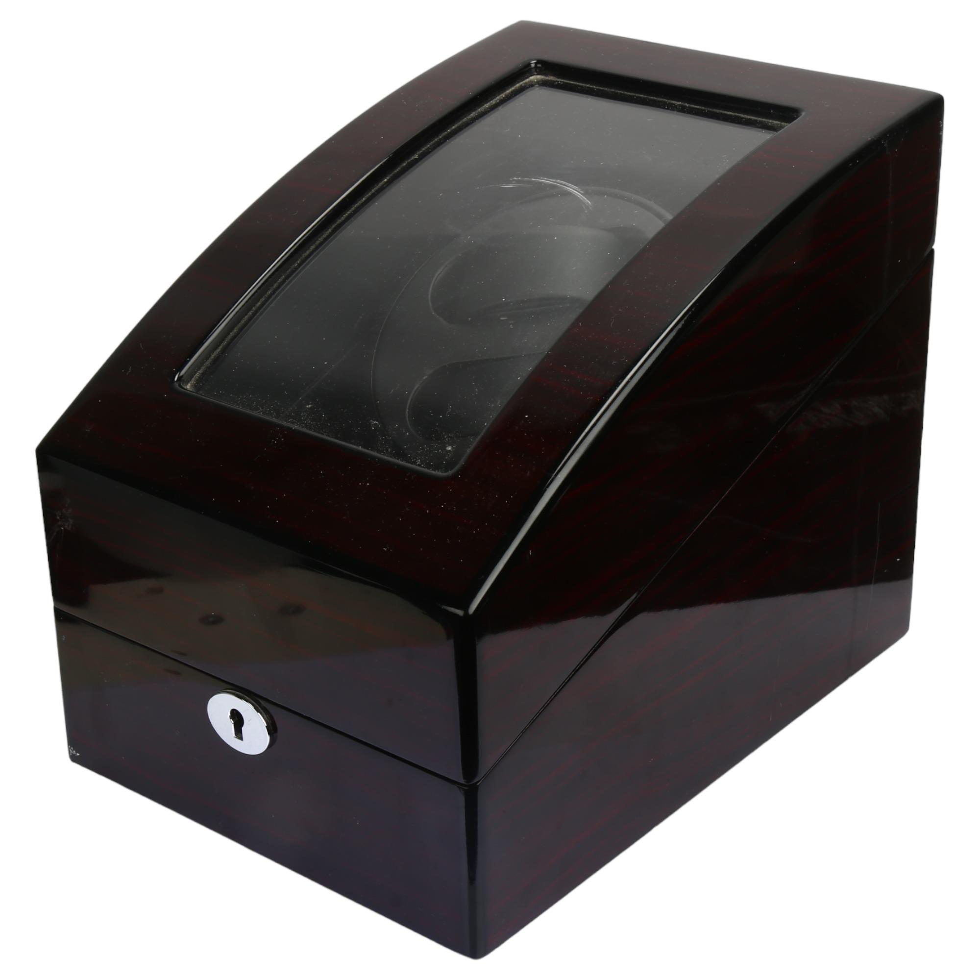 A modern automatic double watch winder, with 3 sub-compartments and mains/battery power, height