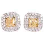 A pair of fancy yellow diamond and diamond halo cluster earrings, 18ct white gold stud fittings with