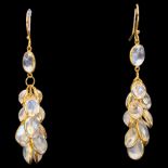 A pair of moonstone cluster drop earrings, unmarked 14ct gold settings with oval cabochon moonstones