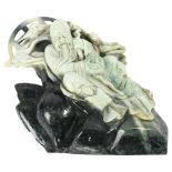 An Oriental carved stone study of a sage and flying cranes, 24cm