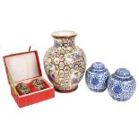 A pair of blue and white ginger jars and cover, a Chinese design baluster vase, and a cased pair