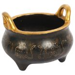 A Chinese bronze 2-handled censer, with gold engraved decoration and character mark to the base,