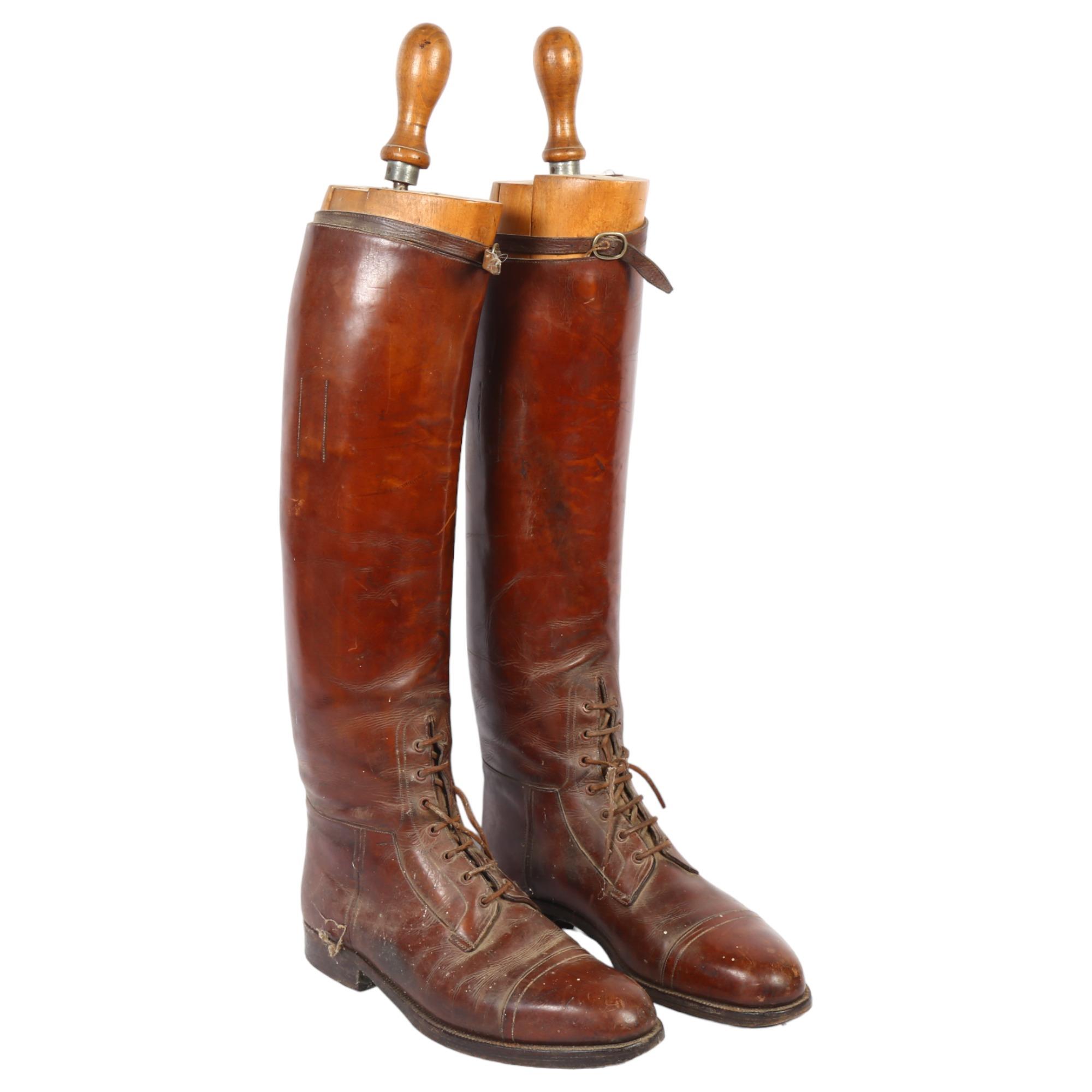 A pair of early 20th century brown leather military riding boots and trees, boot height 49cm approx,