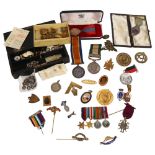 A collection of various military badges medals and others, including a silver-gilt and enamel