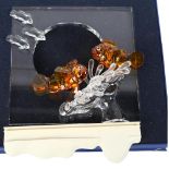 A Swarovski "Harmony" glass frame with applied fish and seaweed, 19cm, boxed, with stand