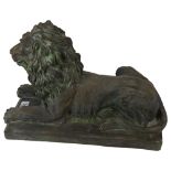 A terracotta lion sculpture on plinth, with verdigris finish, L39cm overall