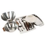 A collection of Danish and German stainless steel serving trays, fruit bowl and servers