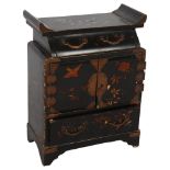 An Oriental black lacquered table-top cabinet, with drawer fitted interior and painted bird and