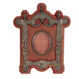 An early 20th century Dutch? silver-fronted photo frame, with relief embossed and pierced swag and