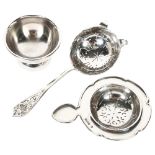 An Elizabeth II Scottish silver tea strainer, pierced thistle decorated handle, hallmarks for