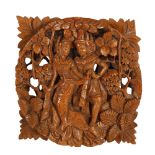 A Balinese intricately carved wood Rama & Sita couple wall plaque, 29 x 29cm