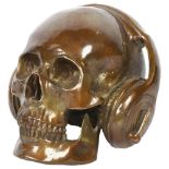 An unusual bronze skull and headphones, H15cm, W16cm