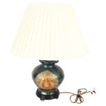 Oriental ceramic table lamp decorated with fruit, and cream shade, H58cm