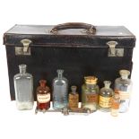 An early 20th century leather physician's case, with various bottles and syringes, no maker's mark