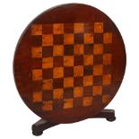 A 19th century apprentice piece games tilt-top table, on turned centre column and on trefoil base,