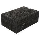 Antique Anglo-Indian carved ebony box with scrolled floral design, and fitted interior containing