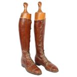 A pair of early 20th century brown leather military riding boots and trees, boot height 48cm,