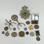 A Victorian police officers helmet badge, quantity of various RAF badges other pin badges,spurs etc