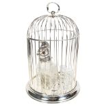 A silver plated parrot design decanter and set of 8 glasses, set in a bird cage, H46cm