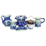 A group of reproduction blue and white china, including various jugs, bowls, and other dishes,