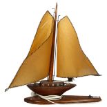 A wooden sailing ship design table lamp, H55cm 1 of the ship's sails has a split through it near the