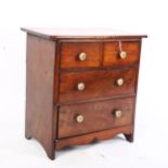 A 19th century mahogany apprentice piece table-top chest of 2 short and 2 long drawers, W28cm, H29cm