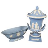 A large Wedgwood Blue Jasperware urn and cover on stand, with design of figures and animals,