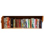 A shelf of hardback novels, annuals etc