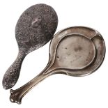 An Arts and Crafts silver-backed hand mirror, Birmingham 1911, and another unmarked hand mirror (2)