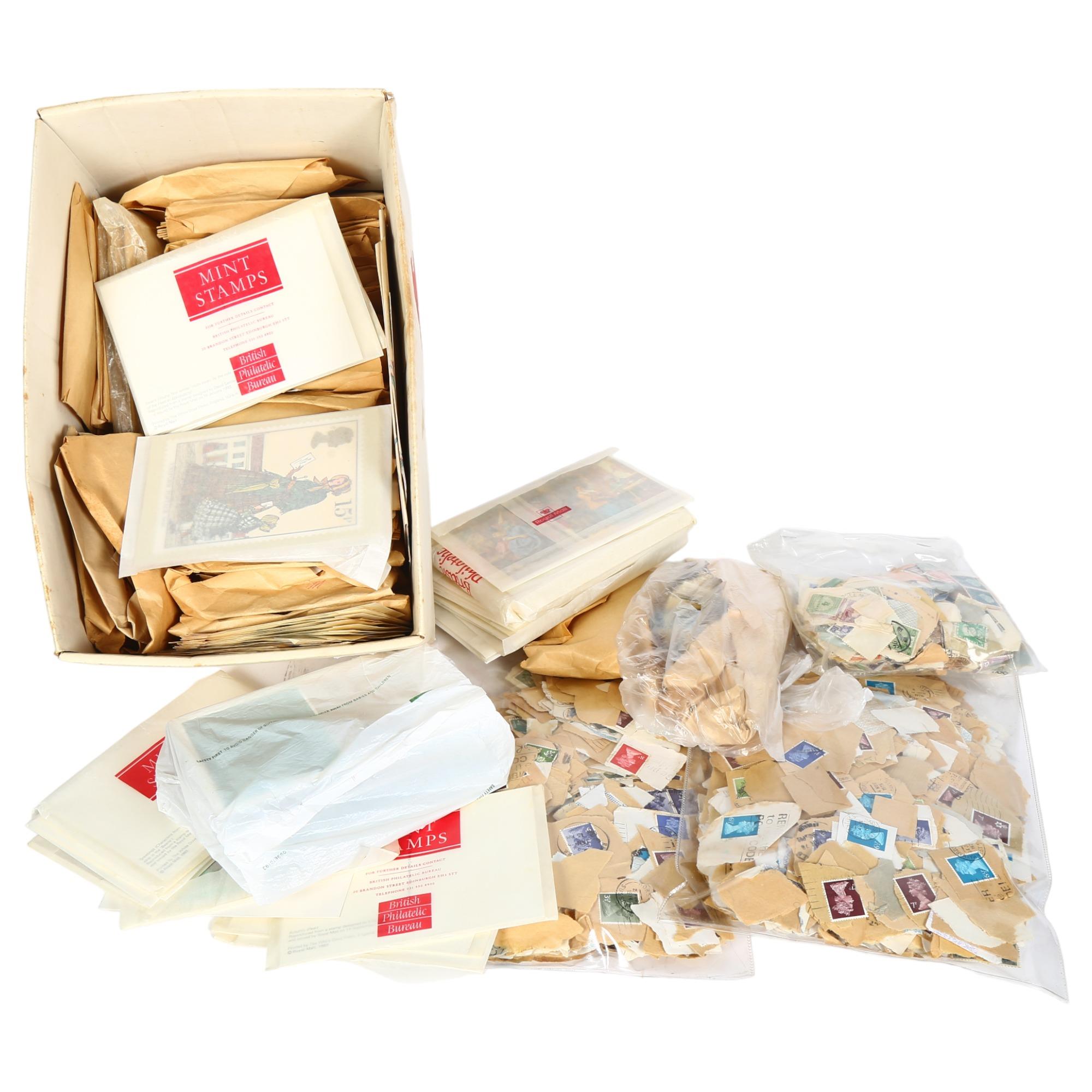 A large quantity of used loose postage stamps, both English and worldwide, including Australia,