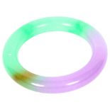 A two-colour jadeite bangle, diameter 8.5cm, internal diameter 6cm