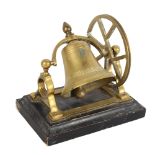 A novelty cast-brass desk bell, on ebonised base, width 18cm General wear to high points, no