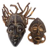 A Congo style carved wood face mask, with leather strap and bamboo strands of hair, length 35cm, and