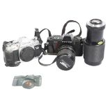 A Canon AL-1QF 35mm SLR film camera, and a Pentax 3P0N camera, and a Vivitar 75-205mm 1:3.8 macro