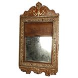 A Moorish design teak and bone inlaid decorative wall mirror, with tambour front, H66cm, W37cm There