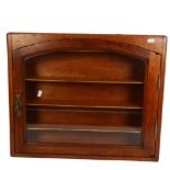 A 1930s oak-framed hanging display cabinet, with fitted shelves and single-glazed door and key,