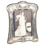 An Elizabeth II silver-fronted strut photo frame, in Art Nouveau style, by Carr's, hallmarks