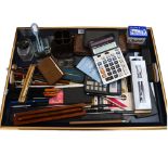 A collection of various pens, Vintage calculators, stamp desk tidy, a Toledo letter opener etc