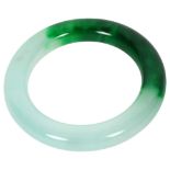 A two-colour jadeite bangle, diameter 8.5cm, internal diameter 6cm