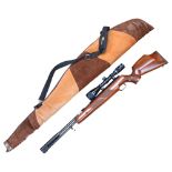 A Weihrauch HW97K .22 calibre air rifle, with a Bush Master 4-12 X40 scope, overall length 102cm,