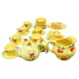 An Arthur Wood moulded and painted jug with fruit design, and a similar Vintage tea service, with