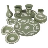 A group of Wedgwood Green Jasperware items, including a box, plates and vases, tallest 13cm
